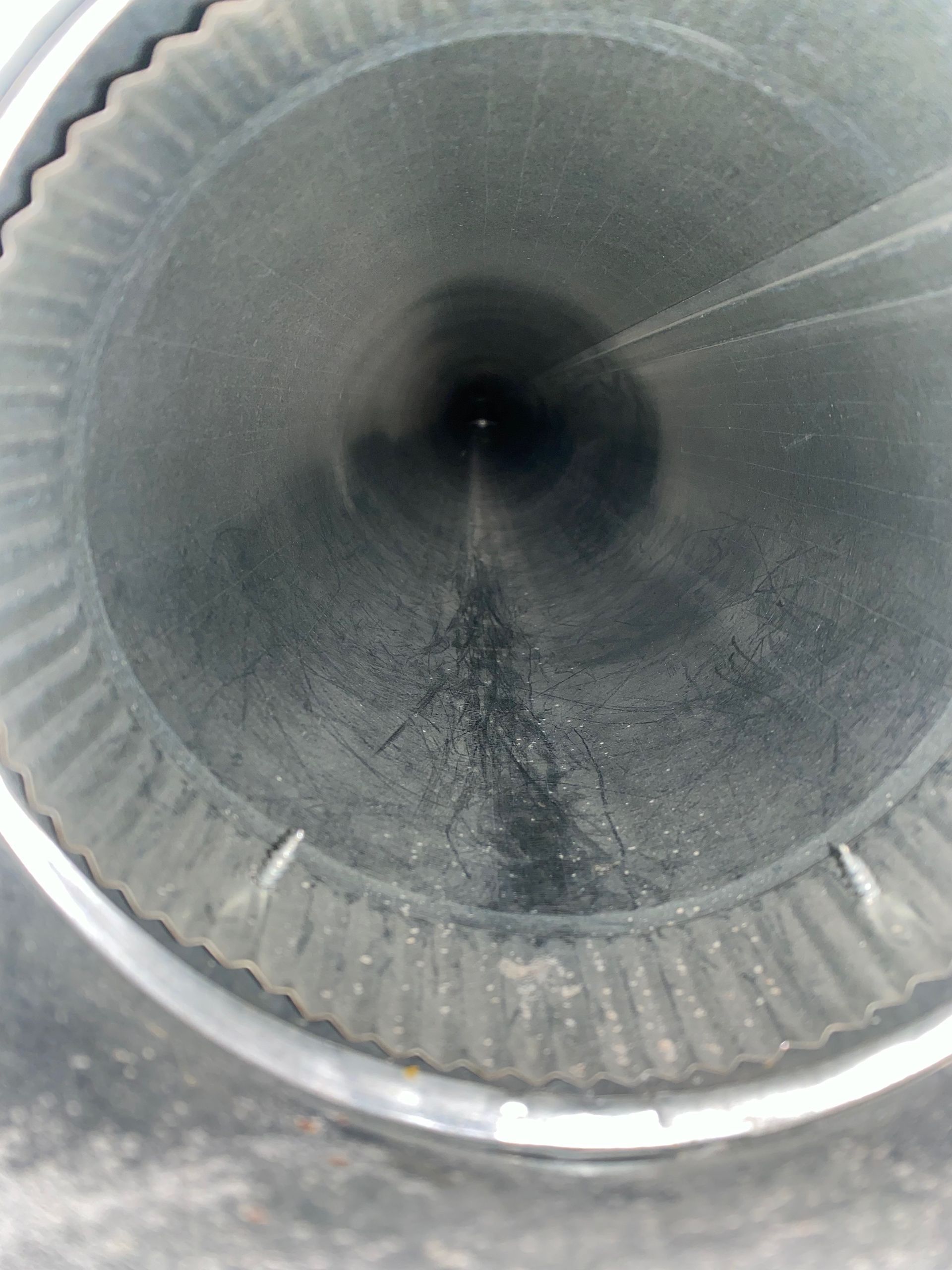 A close up of the inside of a metal pipe