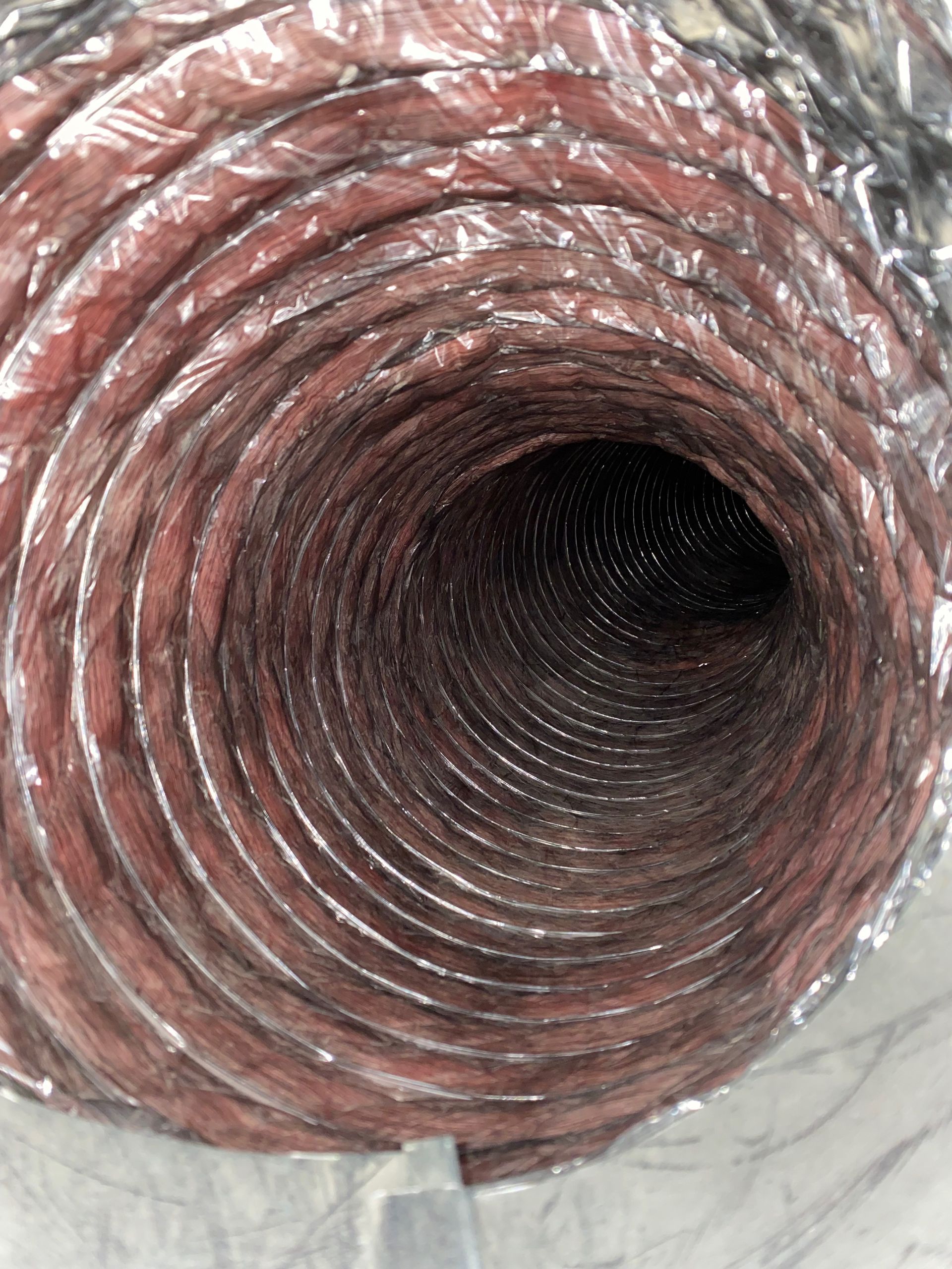 A close up of a duct with a hole in the middle
