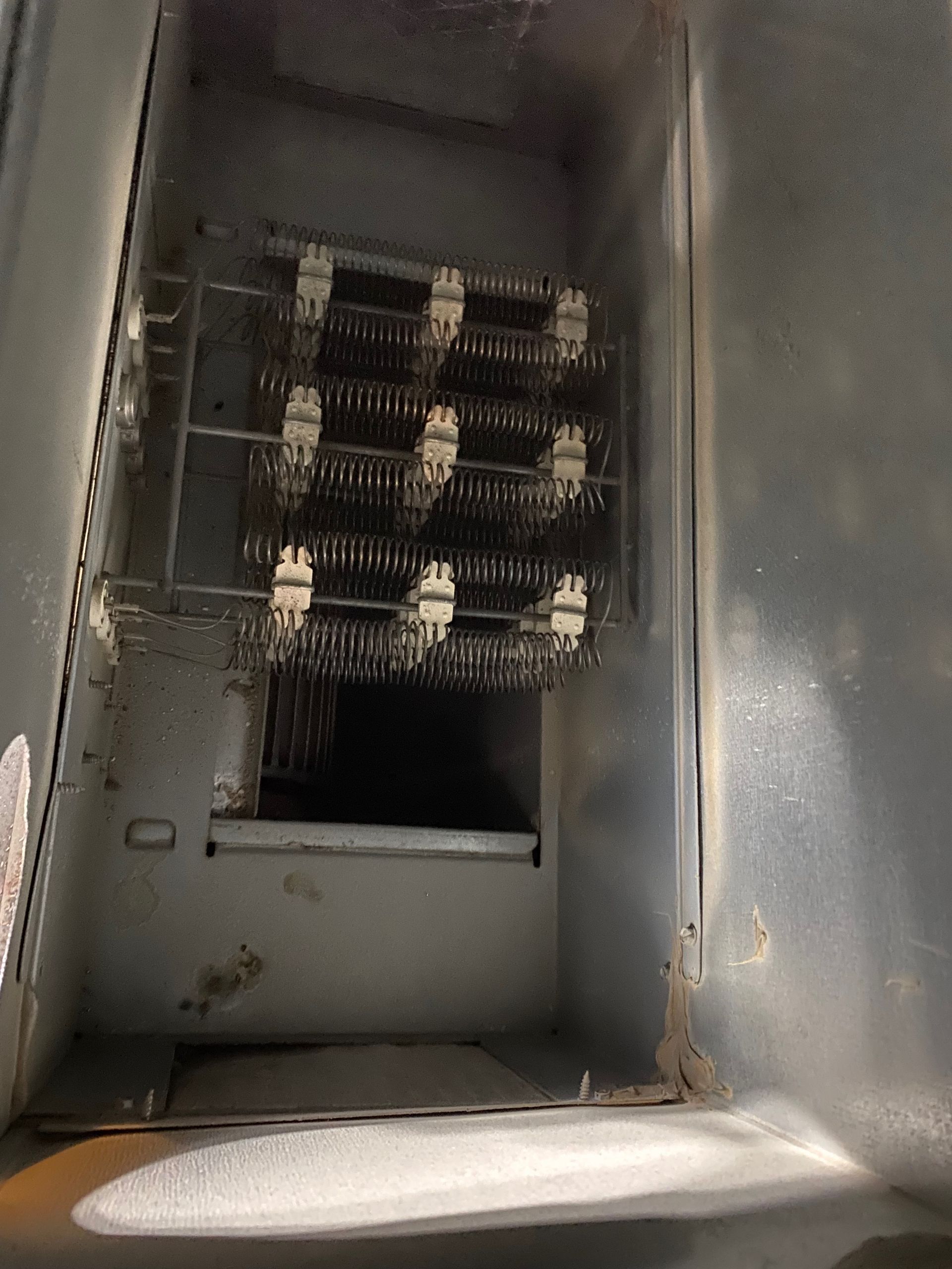 A metal box with a bunch of wires in it
