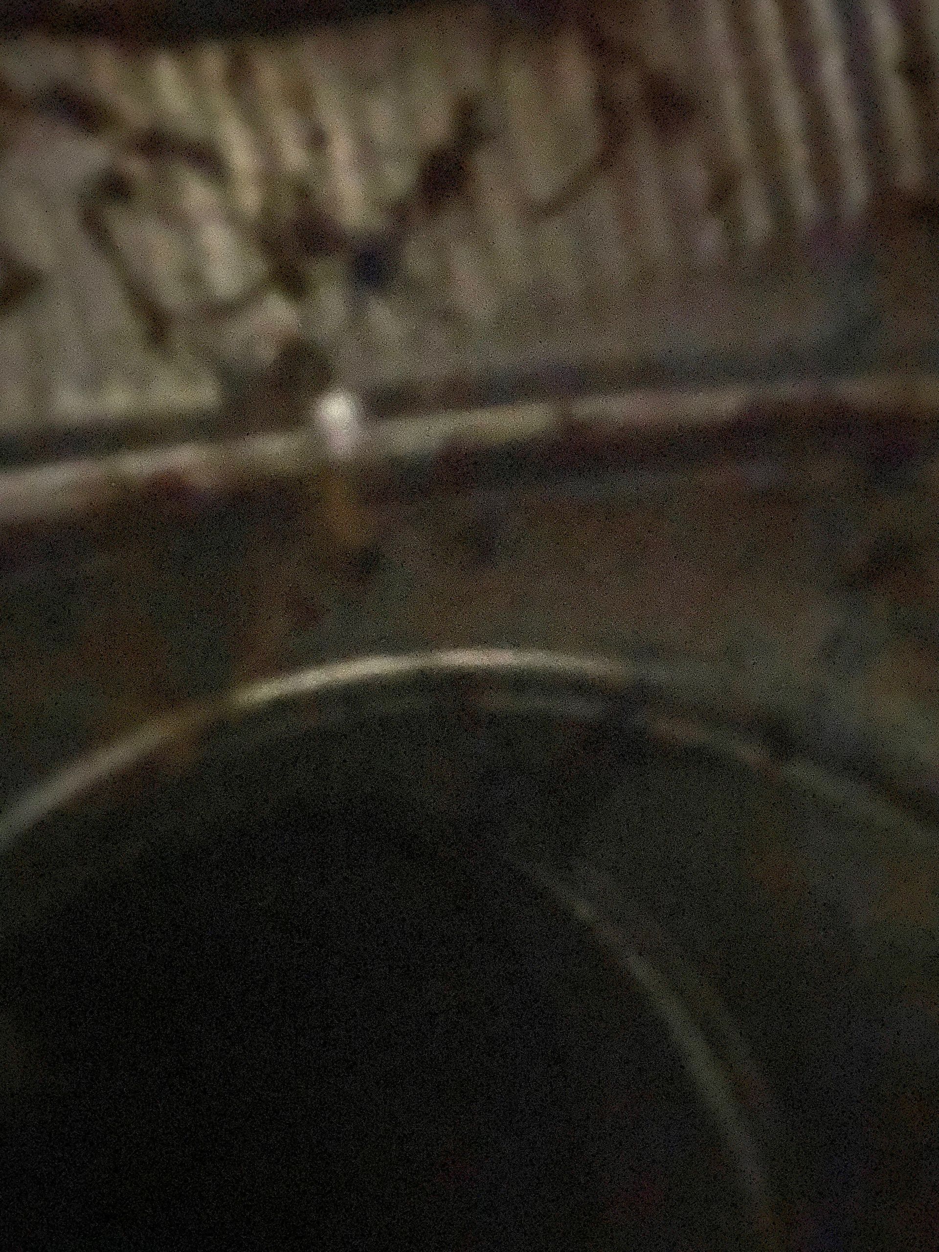 A close up of a metal object with a blurred background.