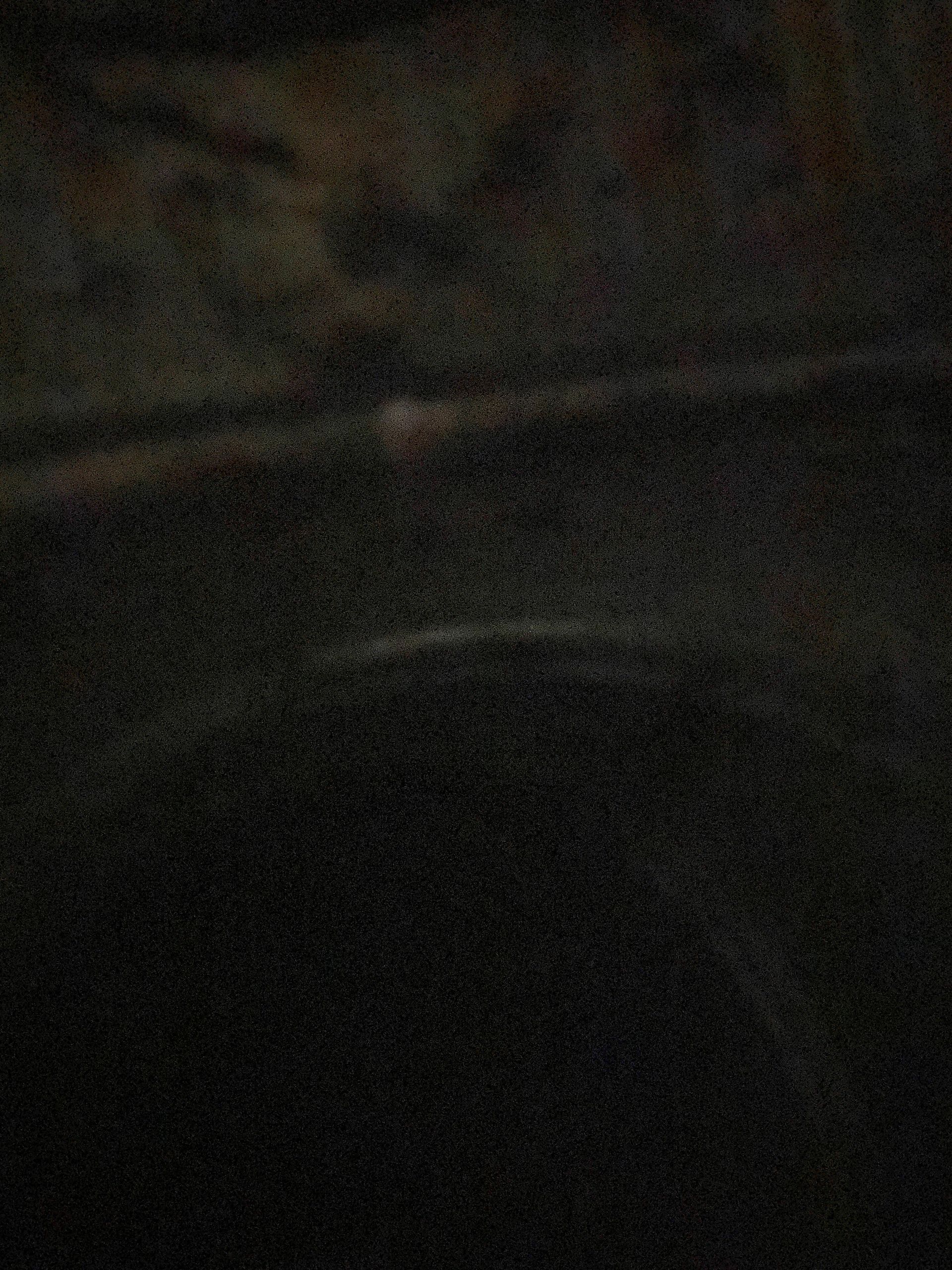 A black background with a lot of small dots on it