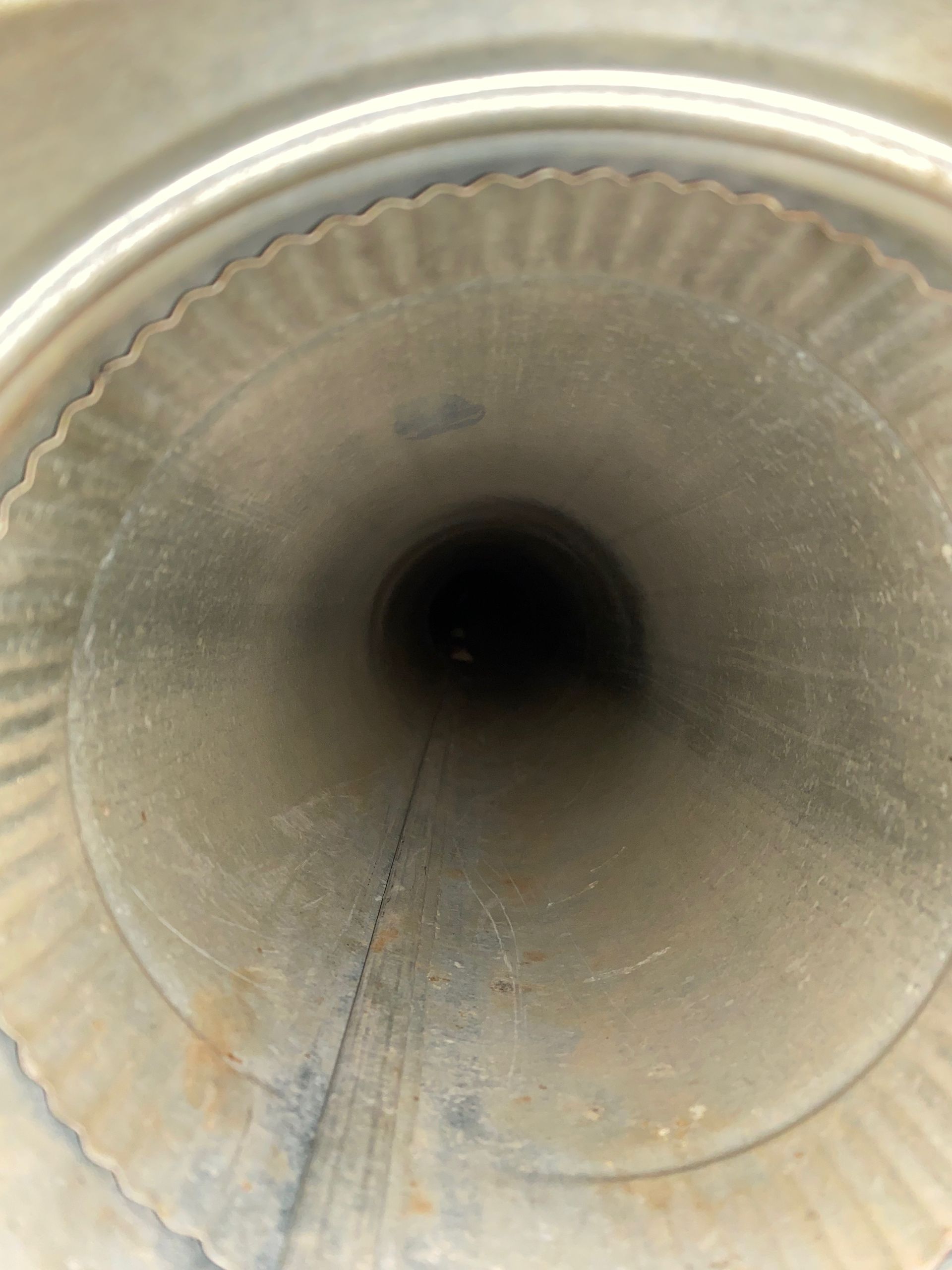 A close up of the inside of a metal pipe