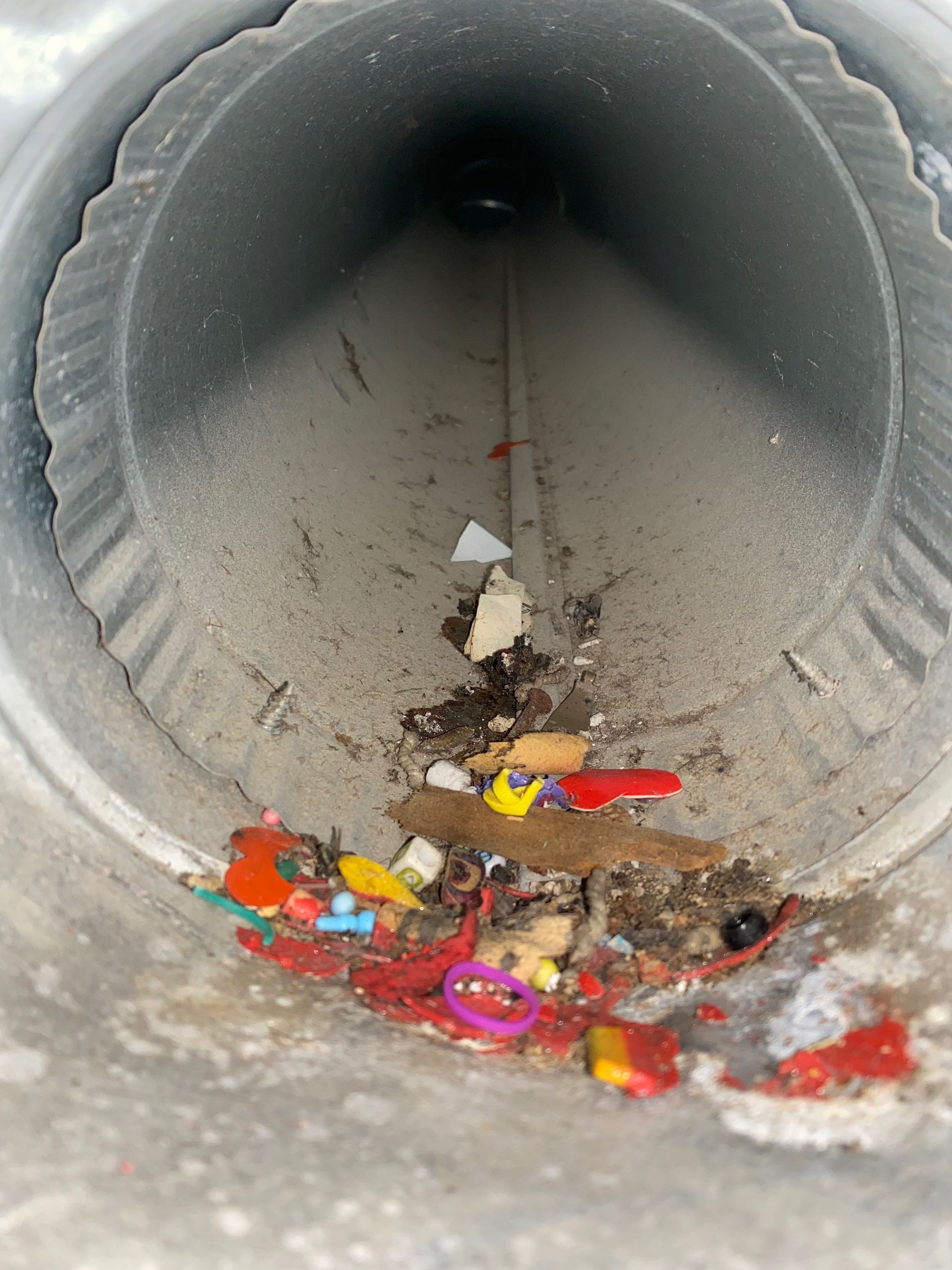 A dirty pipe with a lot of trash in it