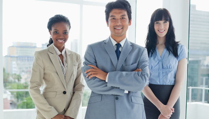 Professional business leader surrounded by team