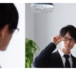 professional manager looking in the mirror