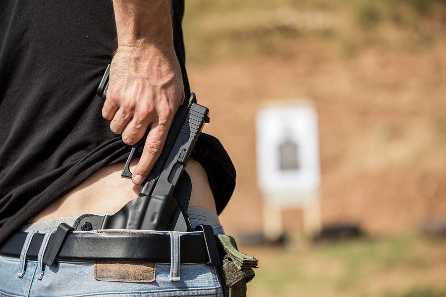 Person With A Gun On Pocket