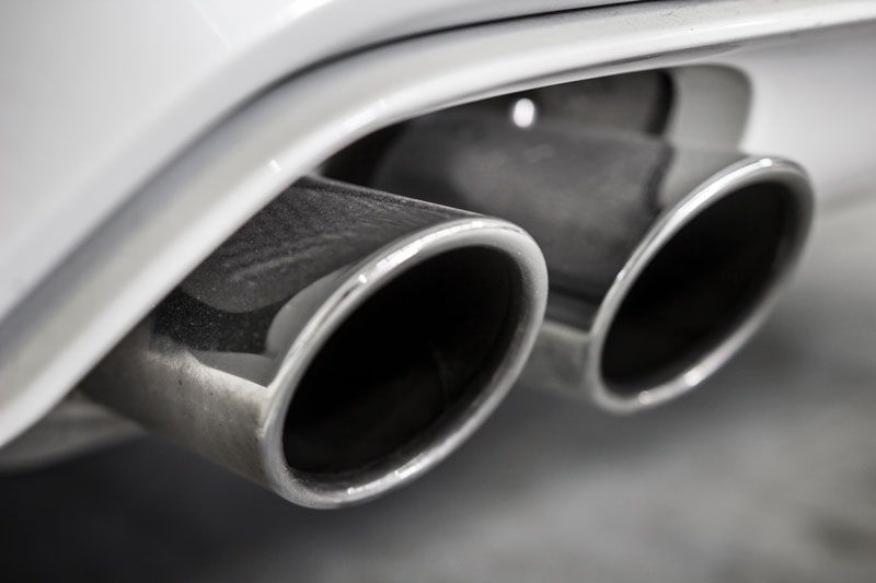 A Close up Of Two Exhaust Pipes on The Back of A Car — Lismore Car Repairs in Lismore, NSW