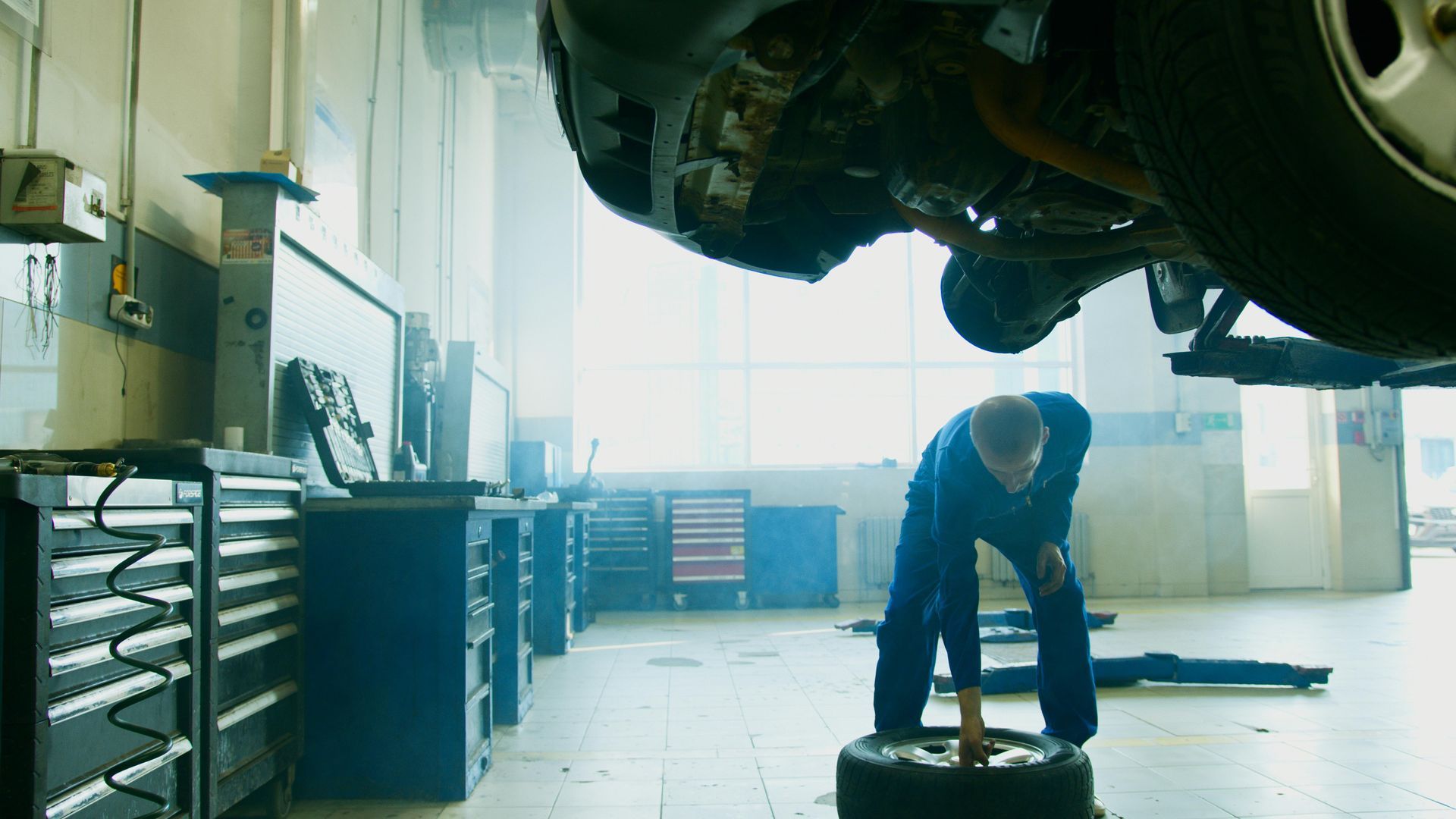 Professional mechanic working on a car engine