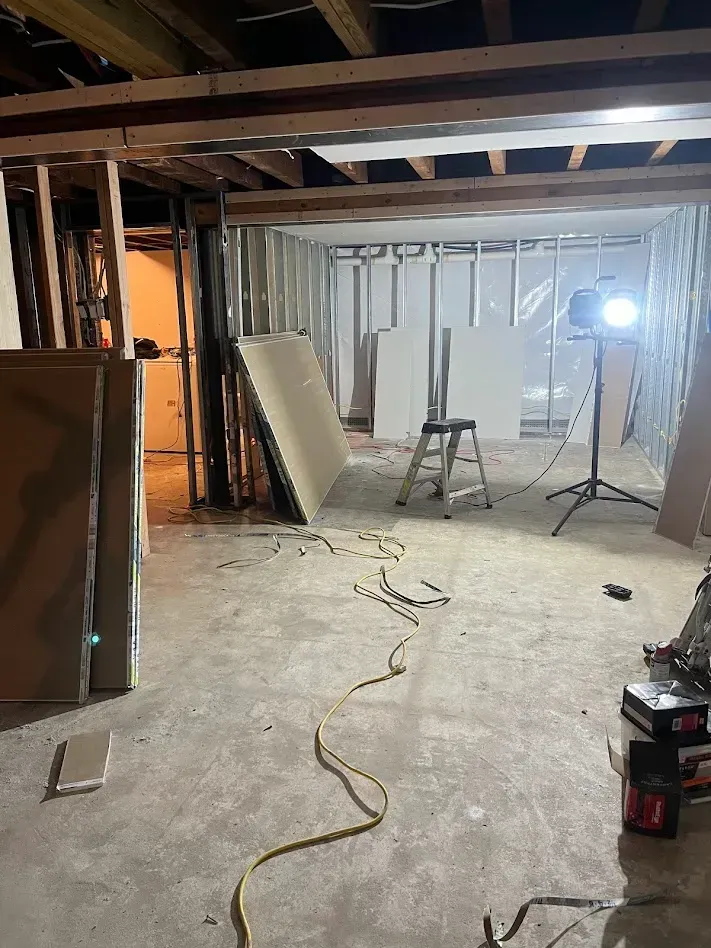 Drywall sheets leaning against walls before installation at a residential project in Drexel Hill, PA.