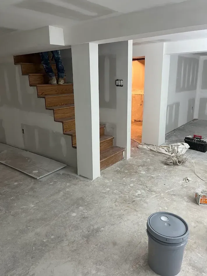 Philadelphia PA drywall finishing – stairway walls completed by Oasis Painting & Drywall.