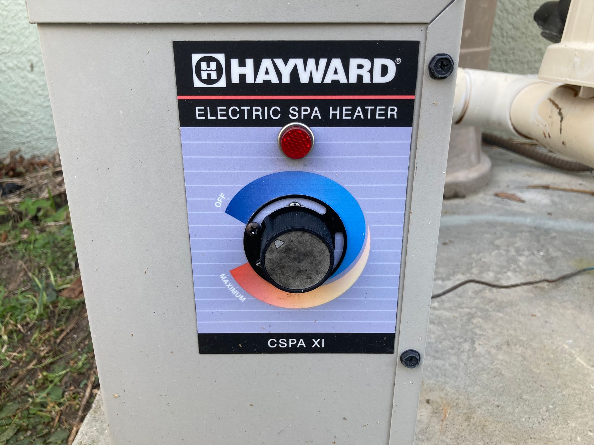 Hayward electric spa heater control panel with dial and indicator light.