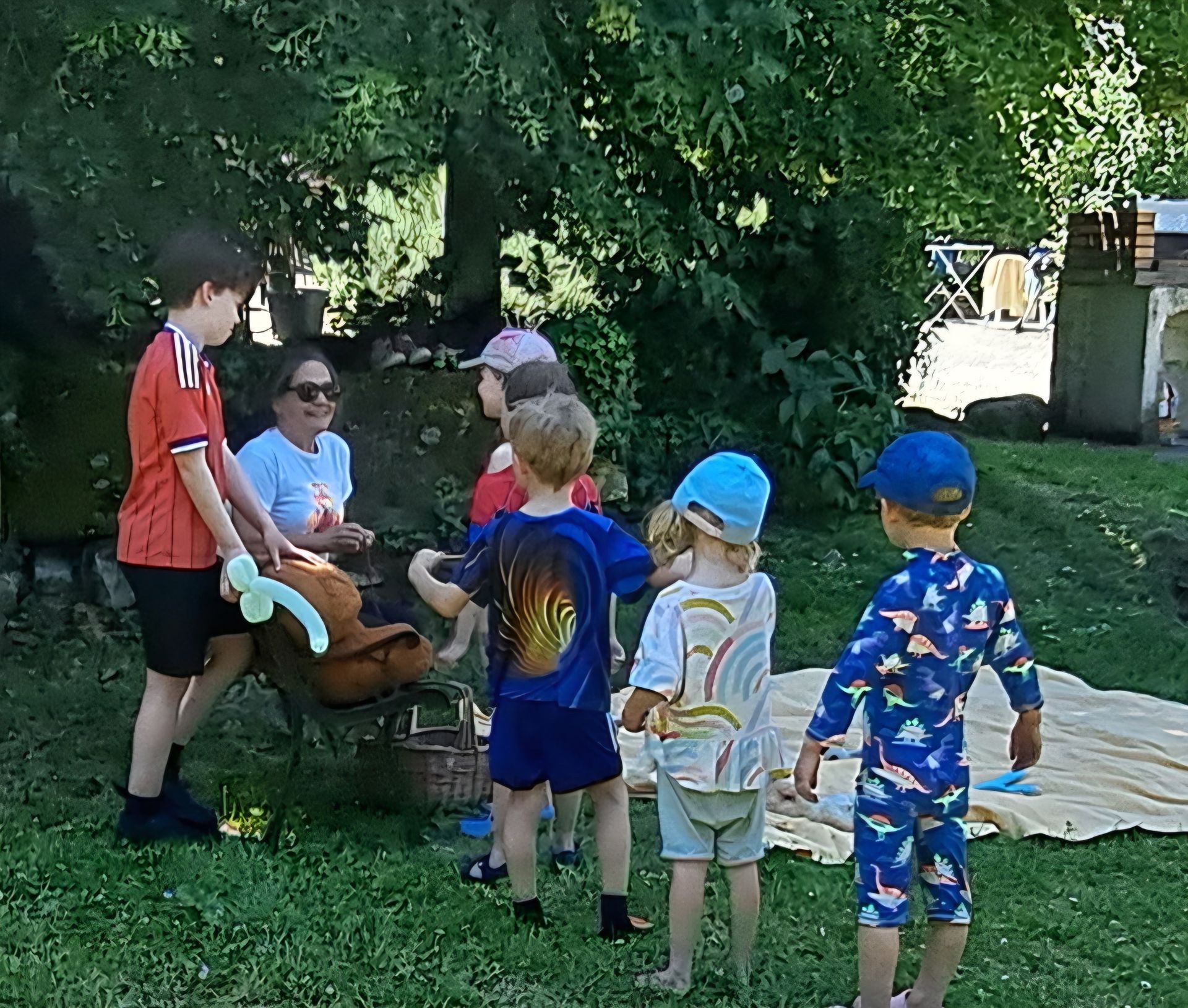group of young children queuing for a balloon