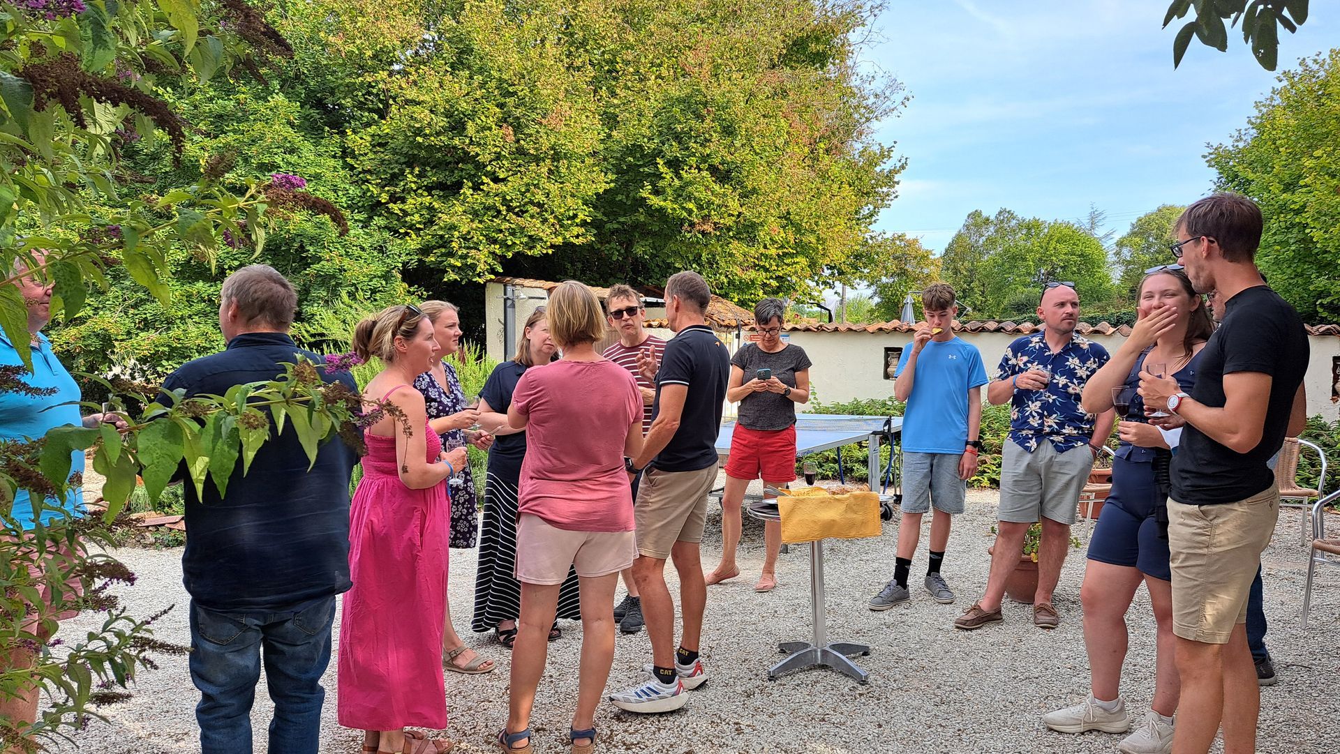 adults enjoying a communal drink outdoors