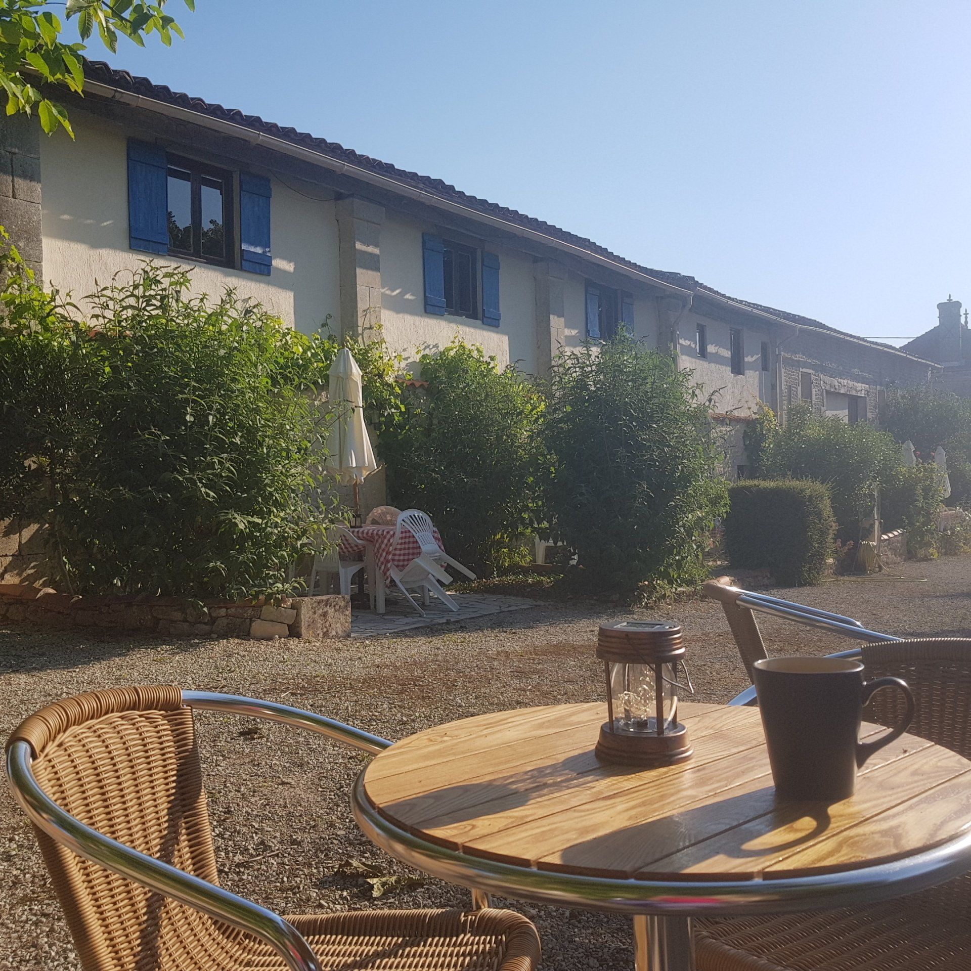 outdoor coffee table with view of stone cottages