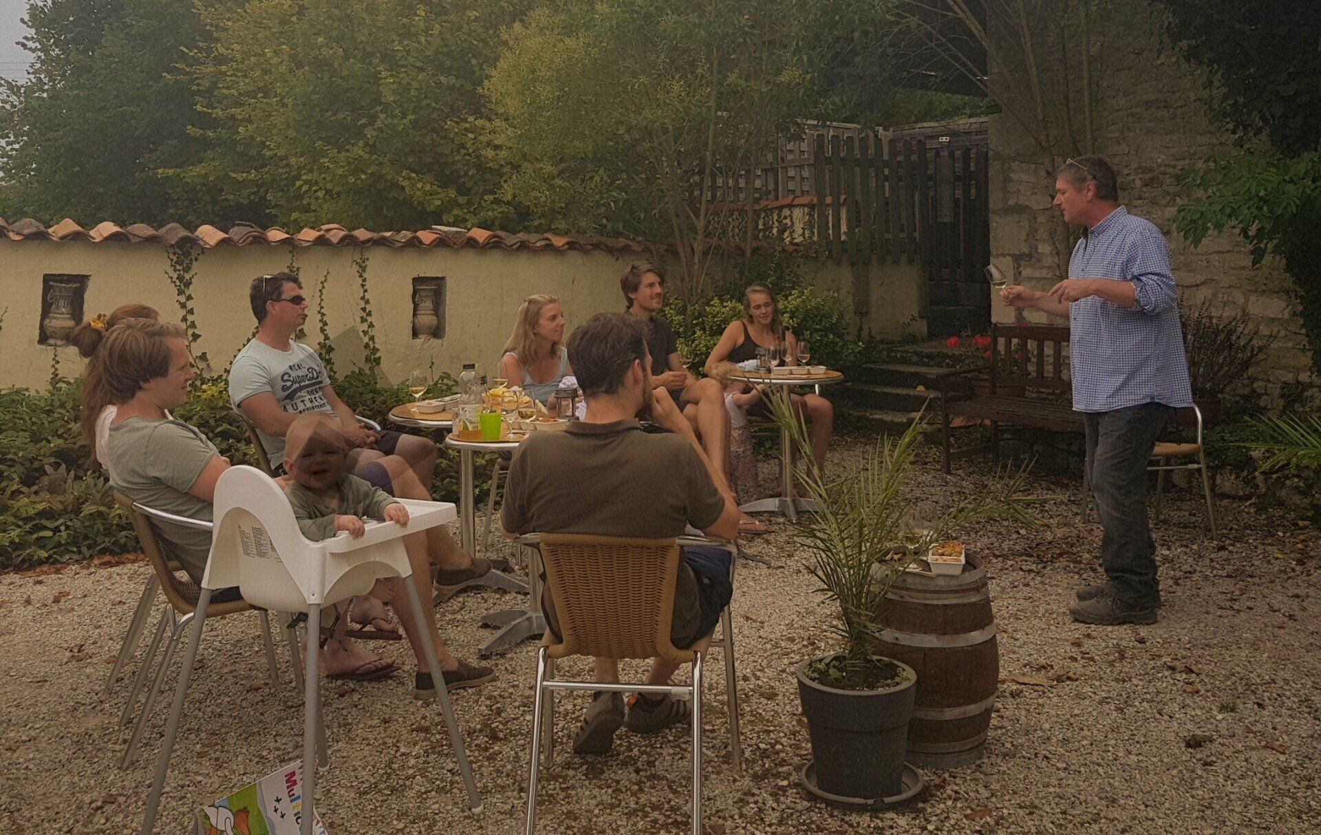 A man teaching holidaymakers about wine