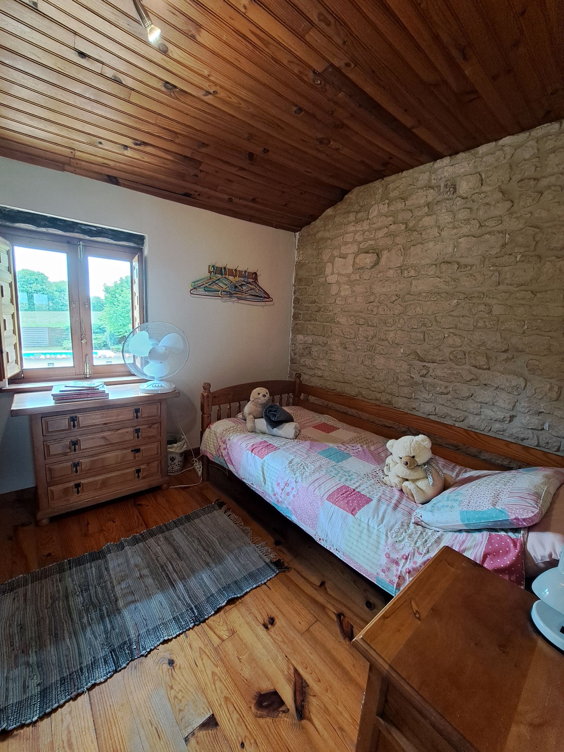 childs bed with pink bedding