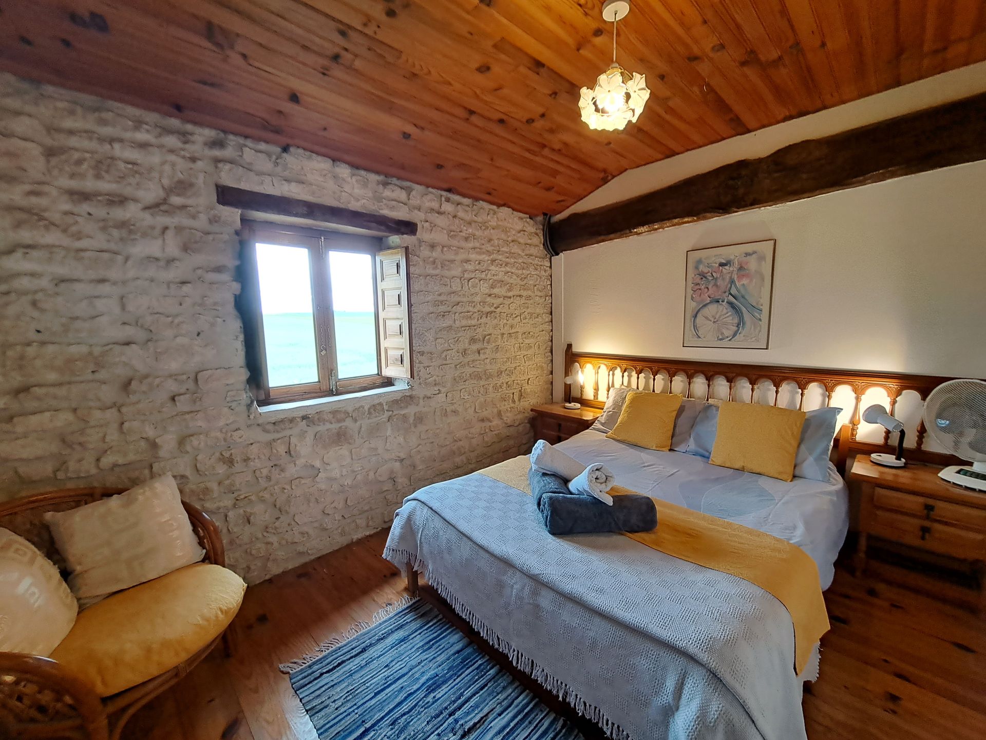 double bed with yellow cushions