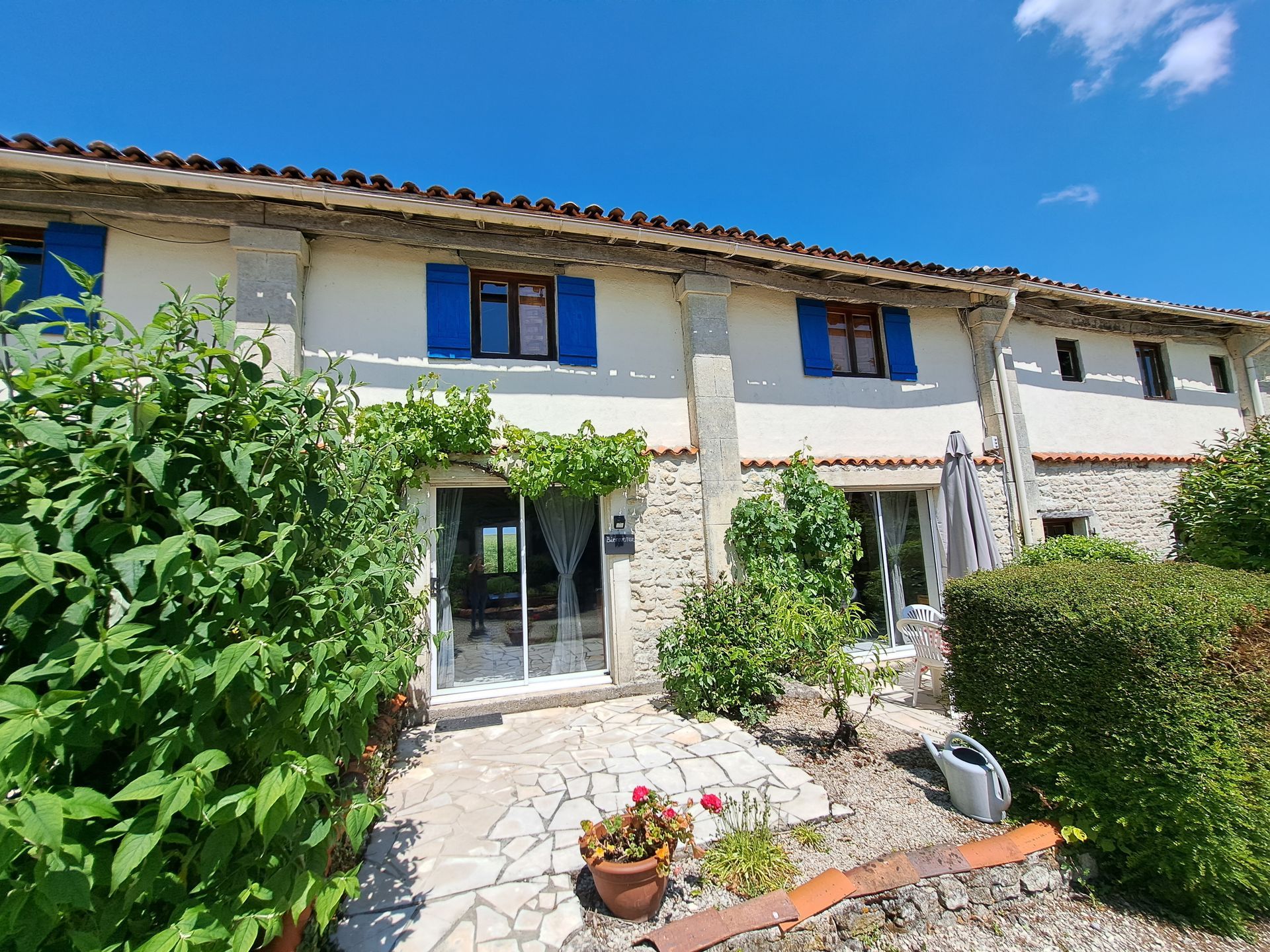holiday cottage with blue shutters 