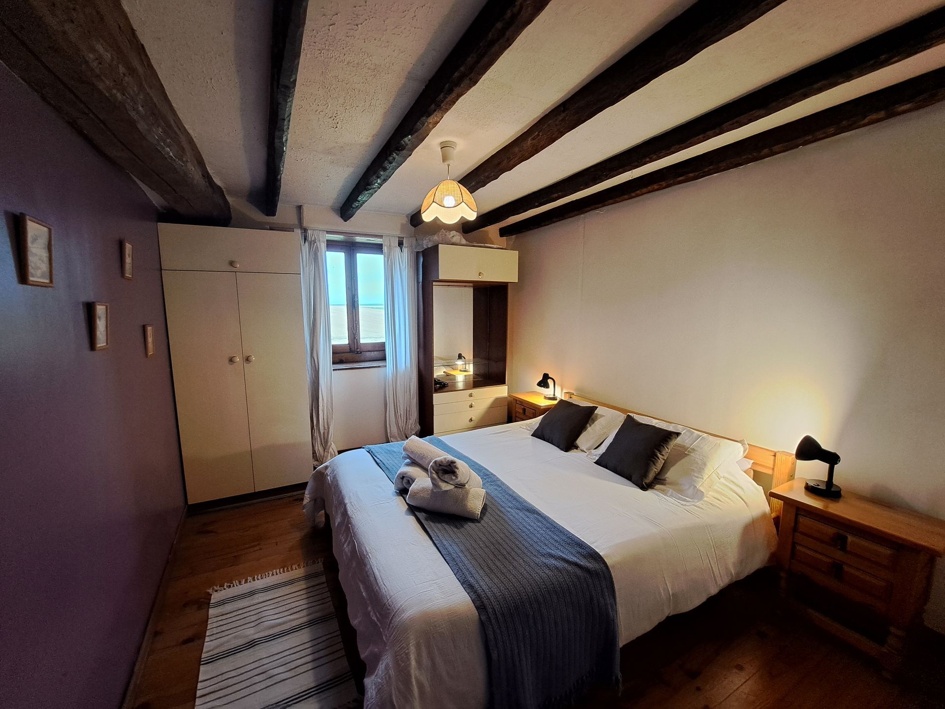 king sized bed with pink duvet cover