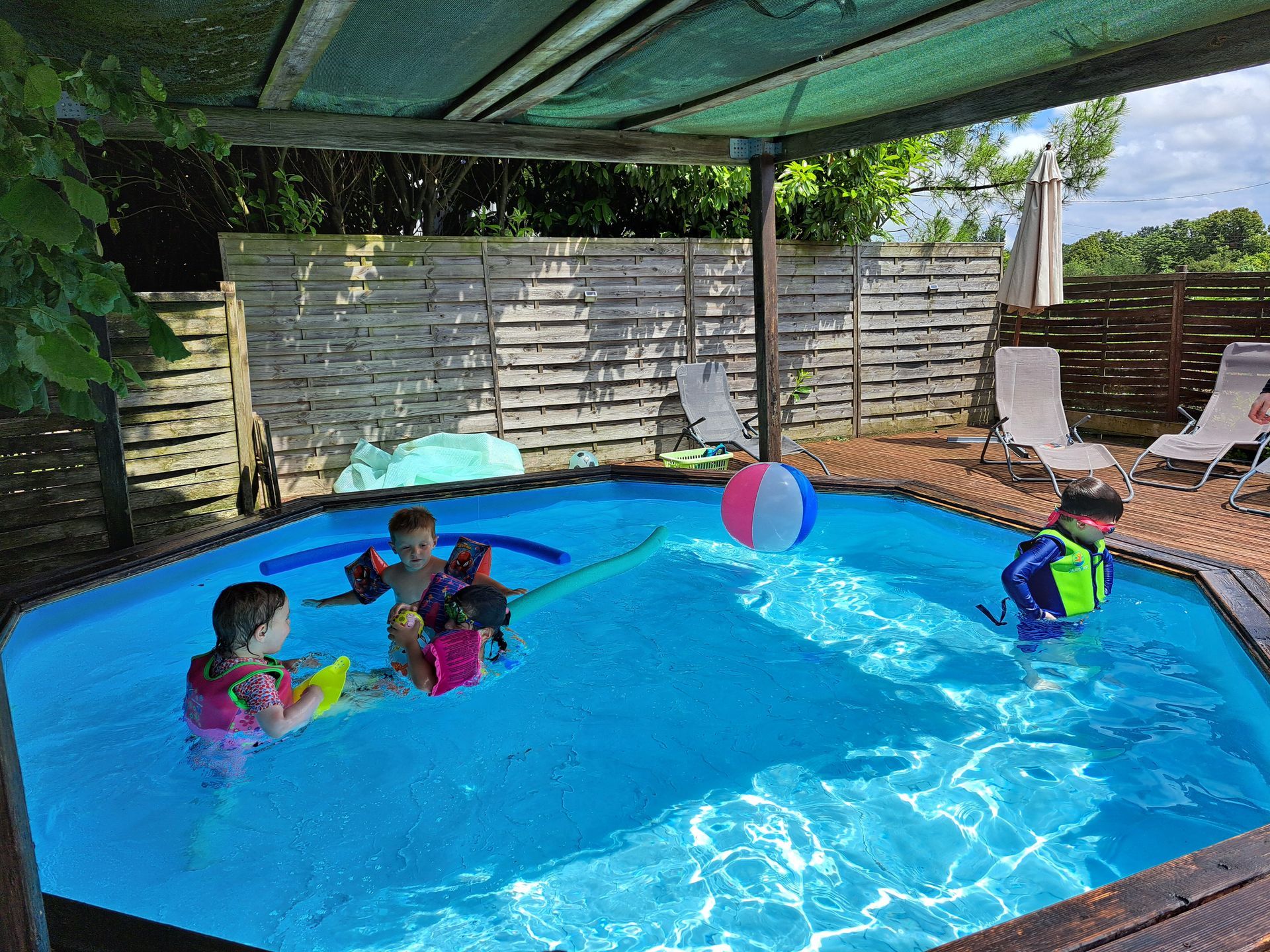 children playing in a toddler pool