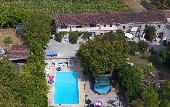 aerial view of holiday cottages in France with rectangular pool
