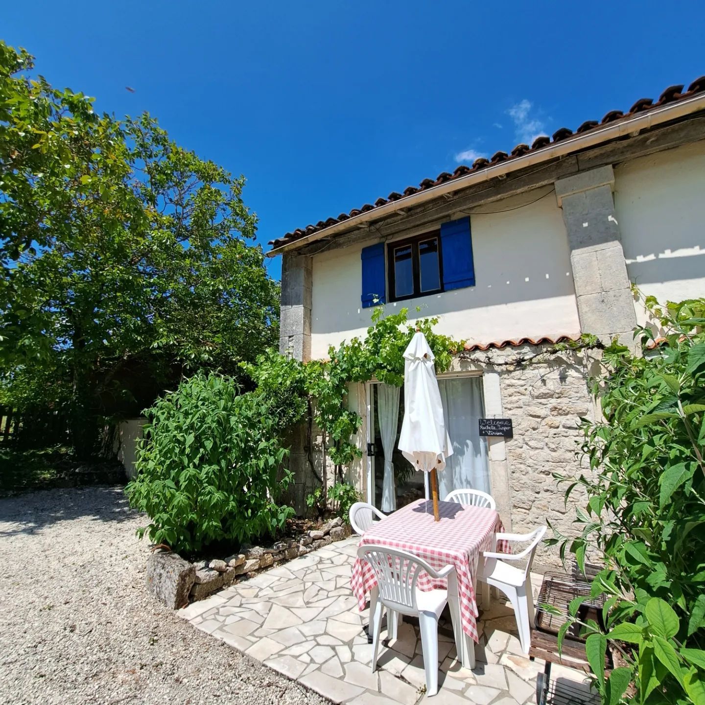 stone cottage with blue shutters