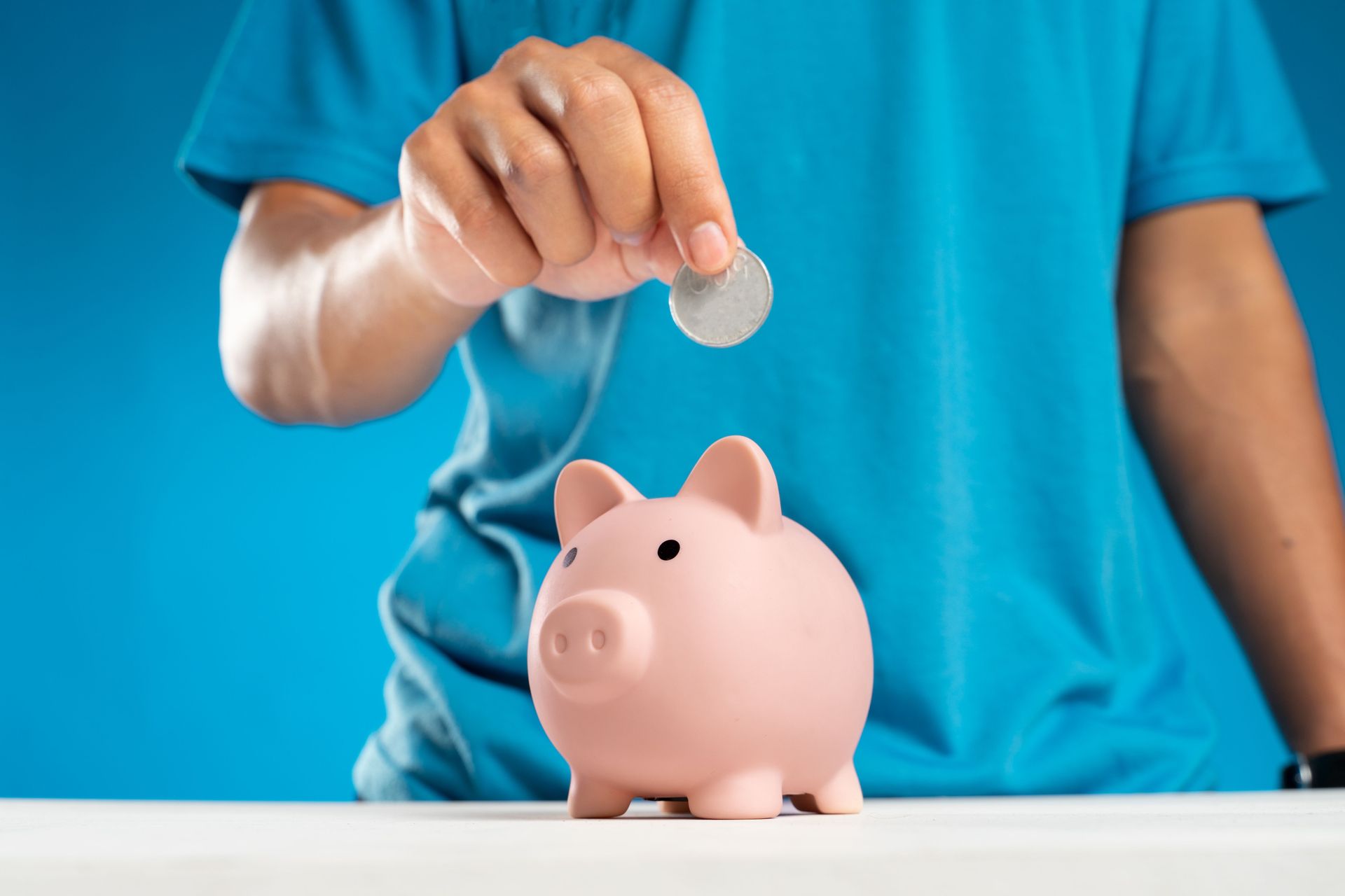 a piggy bank surrounded by coins