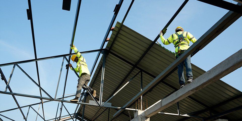 Workers Installing New Roof — Pittsburgh, PA — Ahrn City Contracting LLC Workers Installing New Roof — Pittsburgh, PA — Ahrn City Contracting LLC