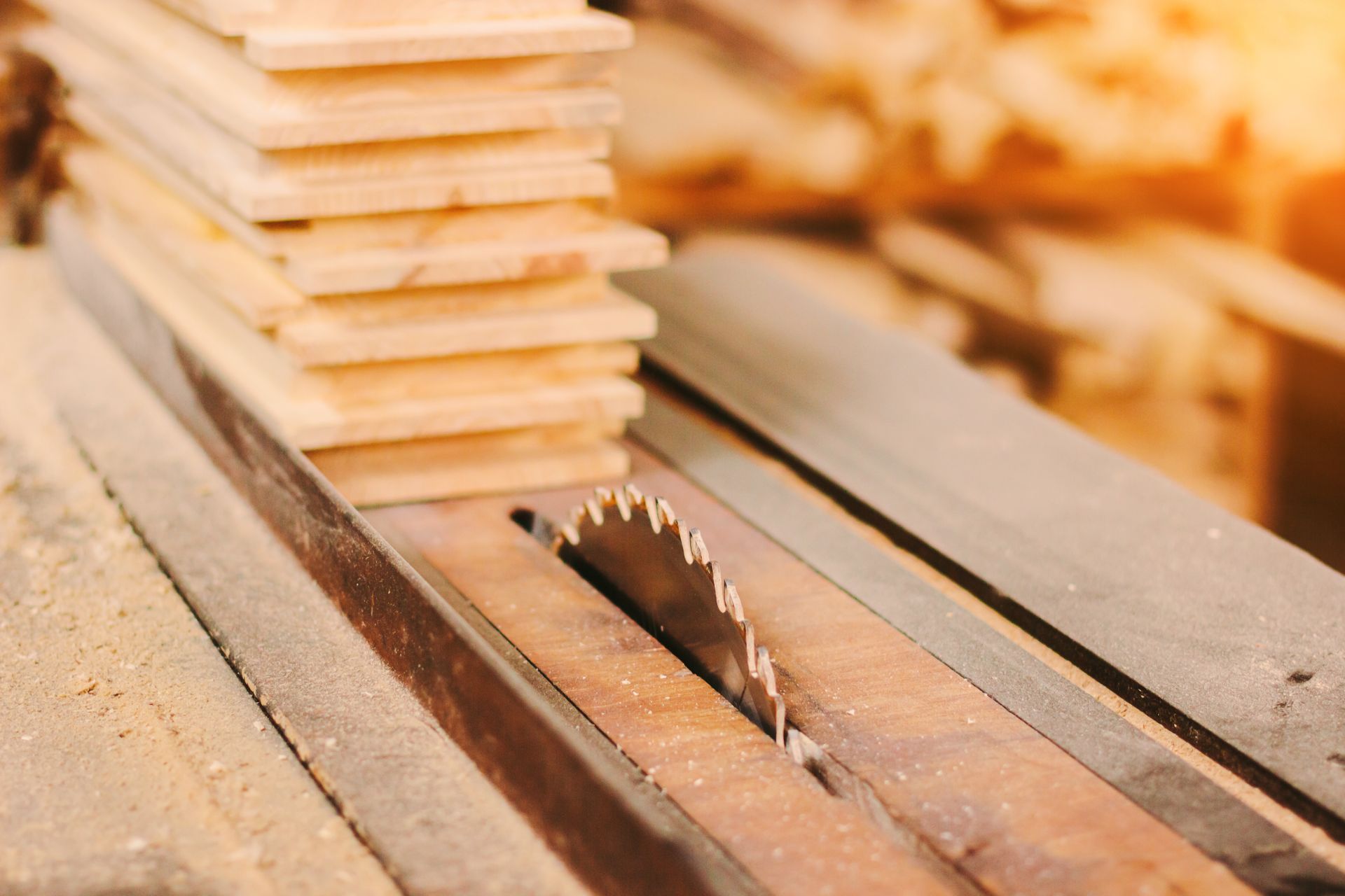 A circular saw is cutting a stack of wood.