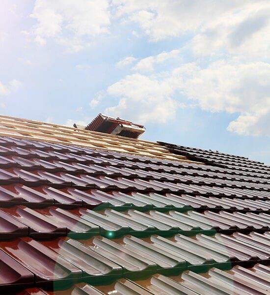 Roof With a Lot of Tiles on It and a Blue Sky in the Background — CP Roofing in Harrington, NSW