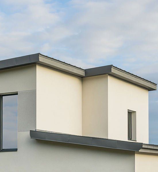 White House With a Black Roof and a Window — CP Roofing in Harrington, NSW