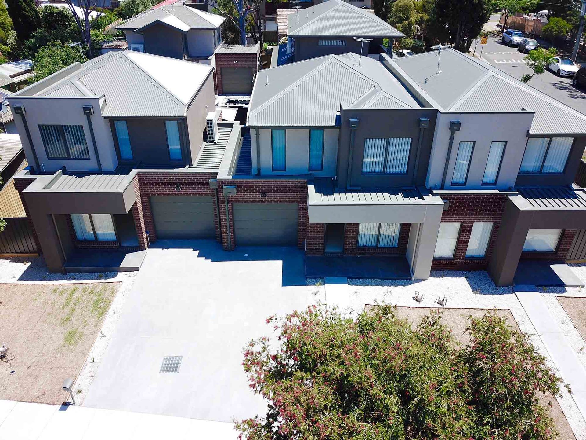 Aerial View of a Row of Houses in a Residential Area — CP Roofing in Old Bar, NSW