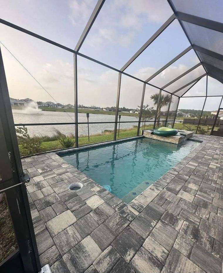 Flagler Beach's Best Surface Restorers! A pool area near Flagler Beach, FL, looks brand new with perfectly sanded, sealed and restored stone pavers.