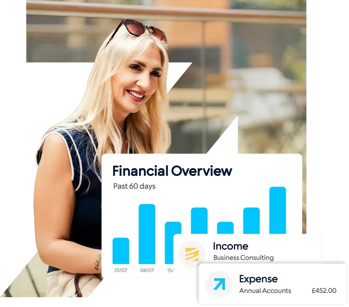 A man is smiling while holding a tablet in front of a financial overview