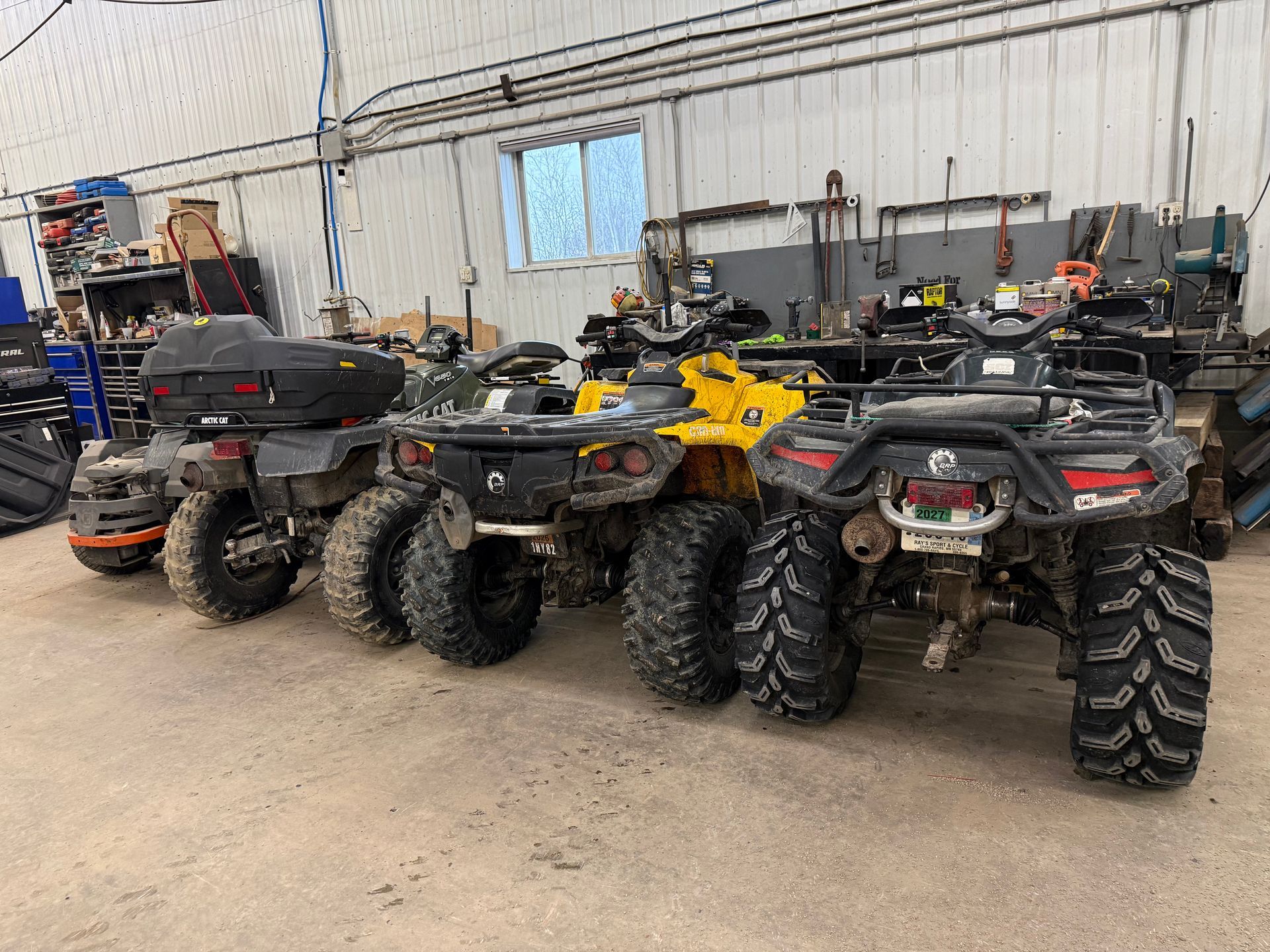 Row of parked ATVs | Itasca Automotive in Bigfork, MN