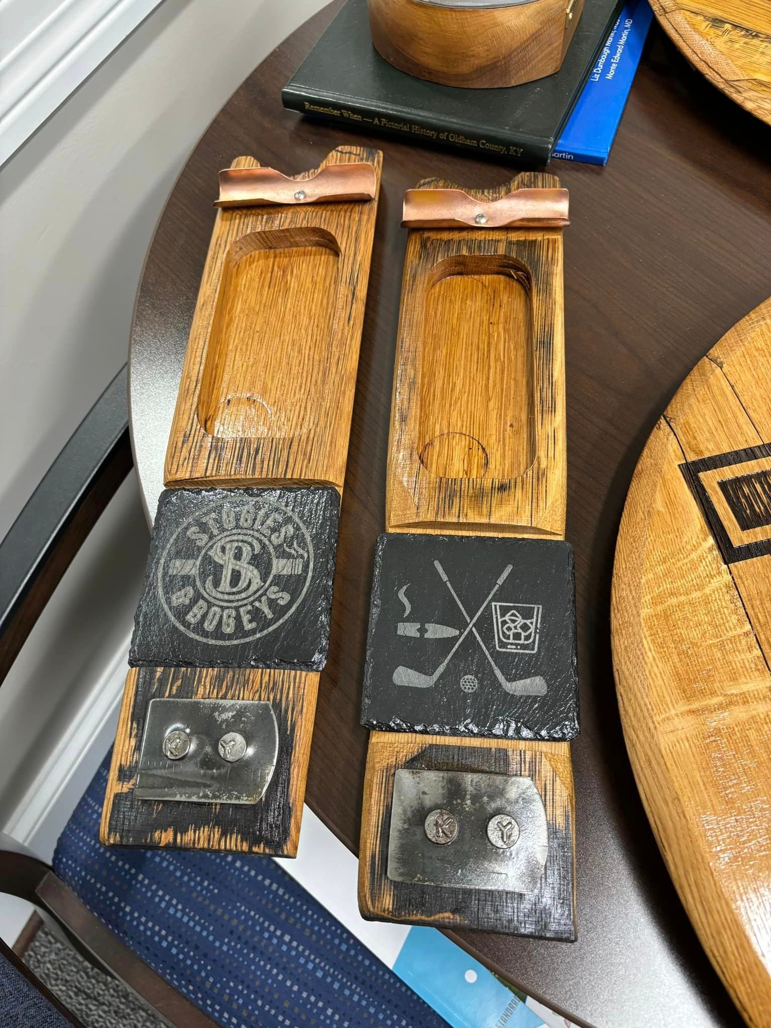 A wooden tray with a hockey stick on it is sitting on a table.