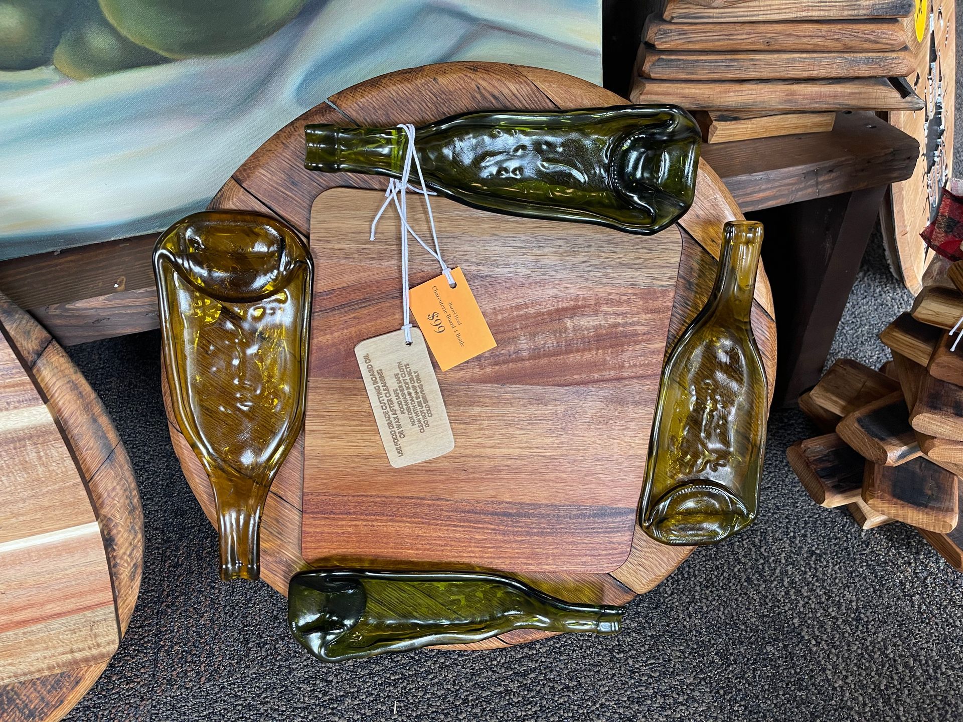 A wooden cutting board with bottles on it