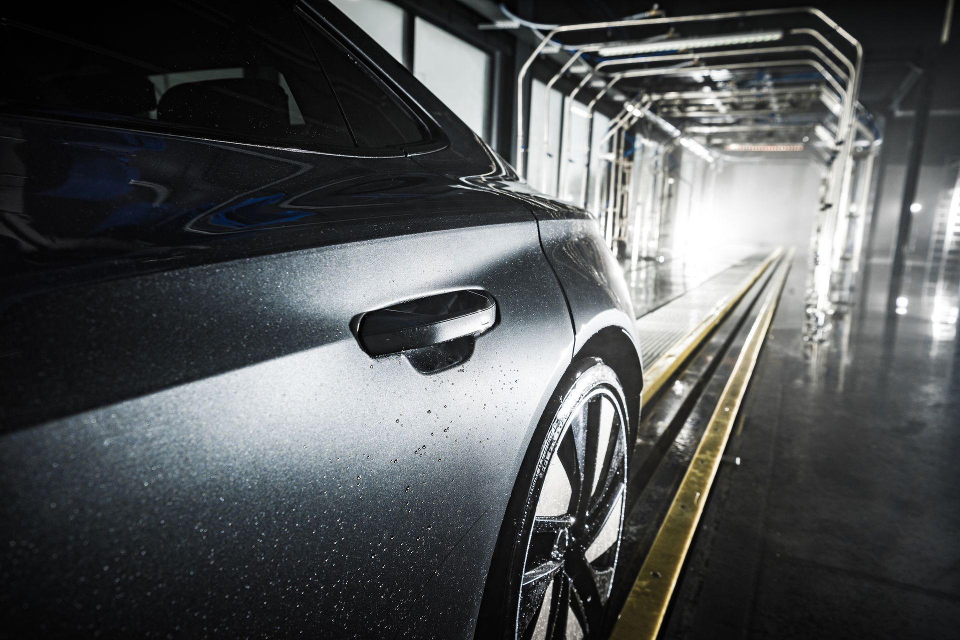 The side end of a modern car under an air blower in a touchless car wash line | Billings MT 