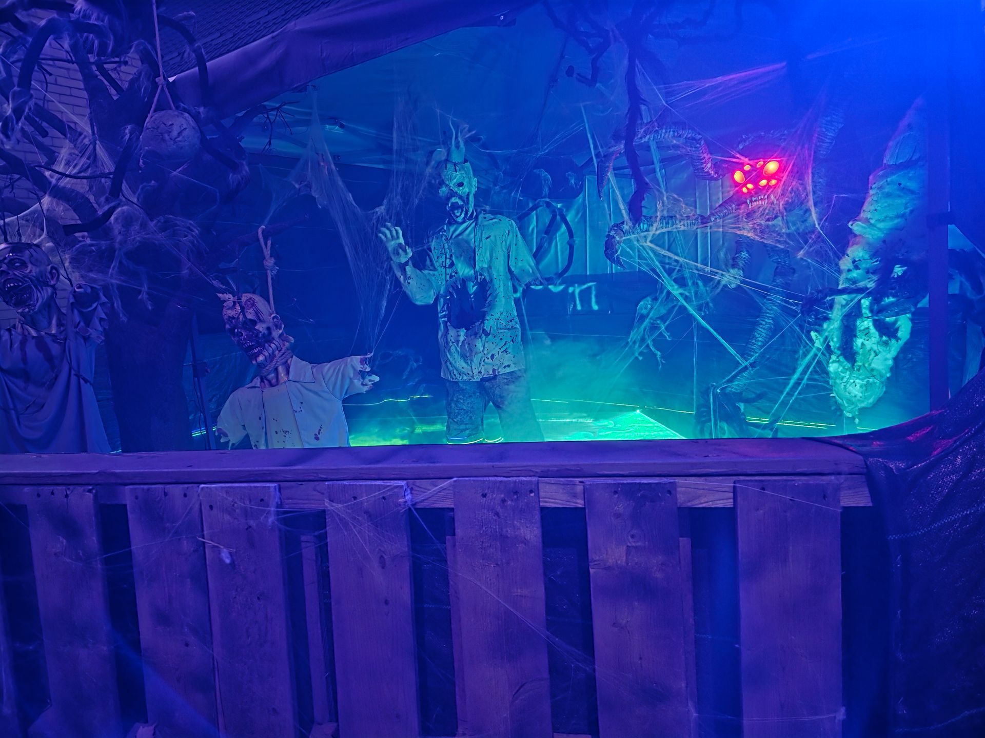 A snapshot o the Halloween Display, wioth zomies and a large spider creature immersed in webs with a fog swamp across their knees