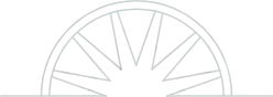 Semi-circle with a radial design; suggests a sun or wheel.