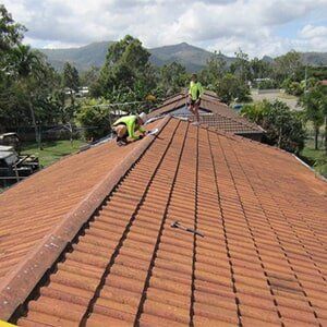 Men Fixing Tail Roof — Ninja Roofing Pty Ltd in Central, QLD Men Fixing Tail Roof — Ninja Roofing Pty Ltd in Central, QLD