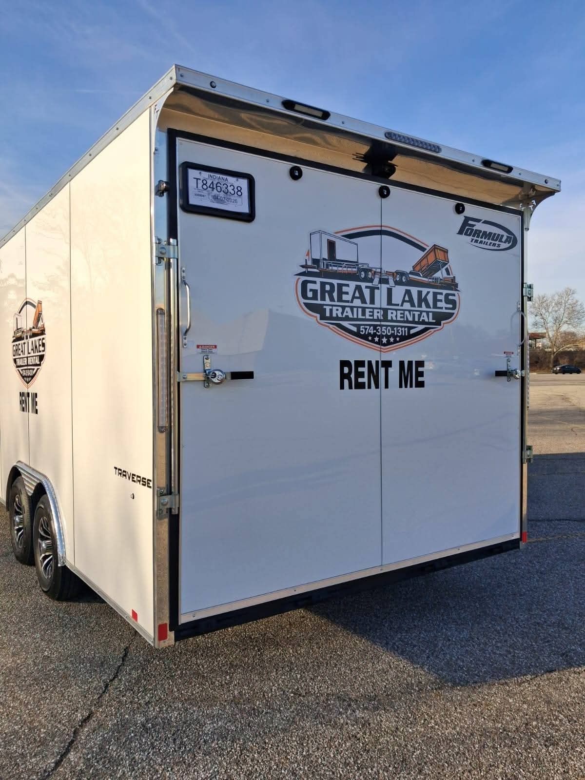 White cargo trailer parked outdoors with