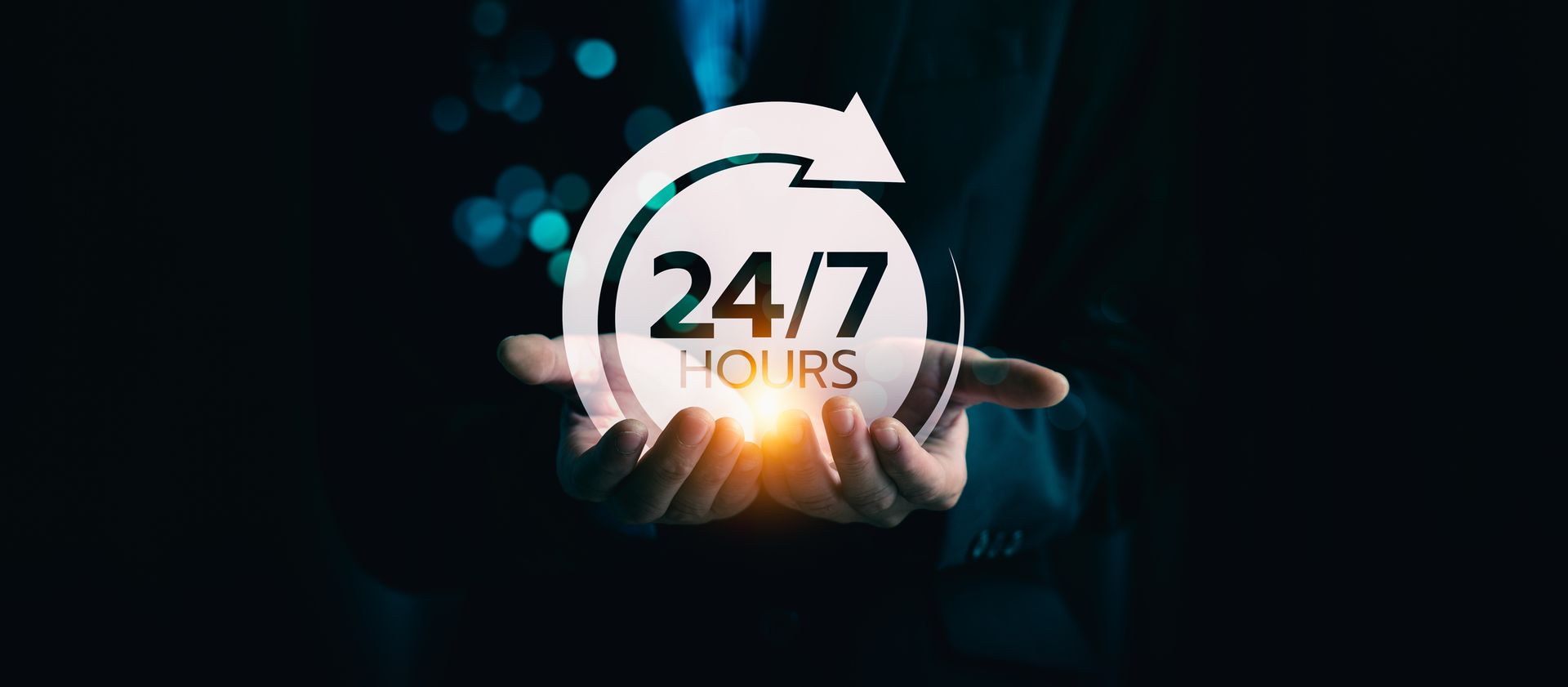 Hands holding a 24/7 support icon with an arrow circling it against a dark blue background.