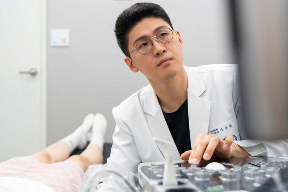 Doctor examining a patient with ultrasound at the Uijeongbu pain clinic