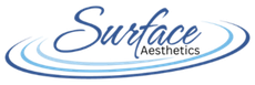 Surface Aesthetics logo in blue script with oval swooshes on a white background