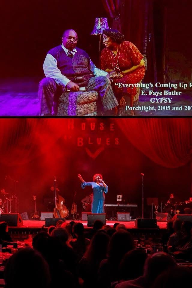 Stage performance: Actor singing, projection of actors on screen, red lighting, audience.