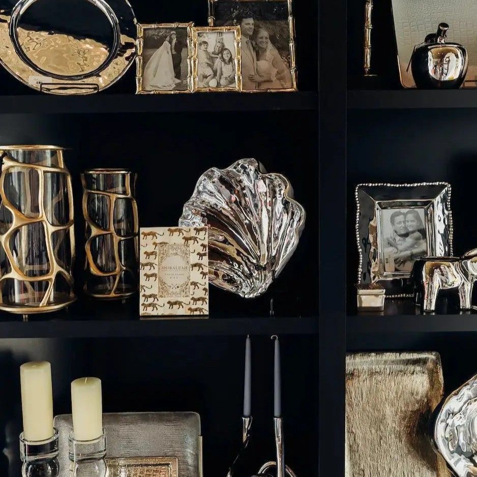 Black shelf display of curated finds inside Black Tie Beach