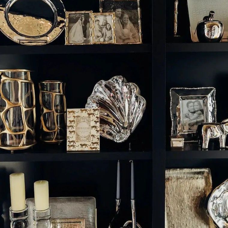 Black shelf display of curated finds inside Black Tie Beach