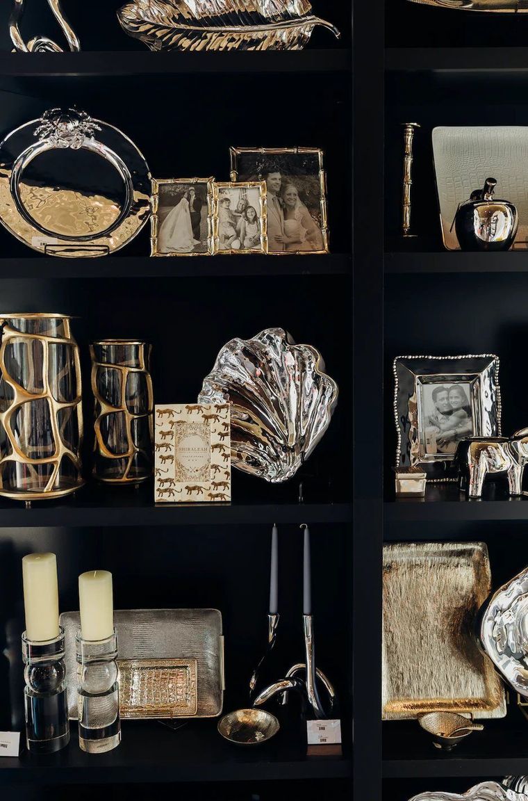 Black shelf display of curated finds inside Black Tie Beach