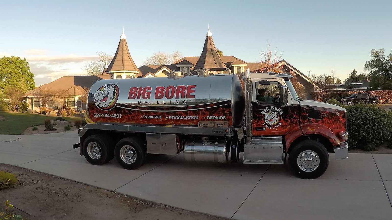 Classy Truck of the Year winner — Pumper Magazine Big Bore Drilling septic pump truck at a residential property in the Fresno-Clovis area